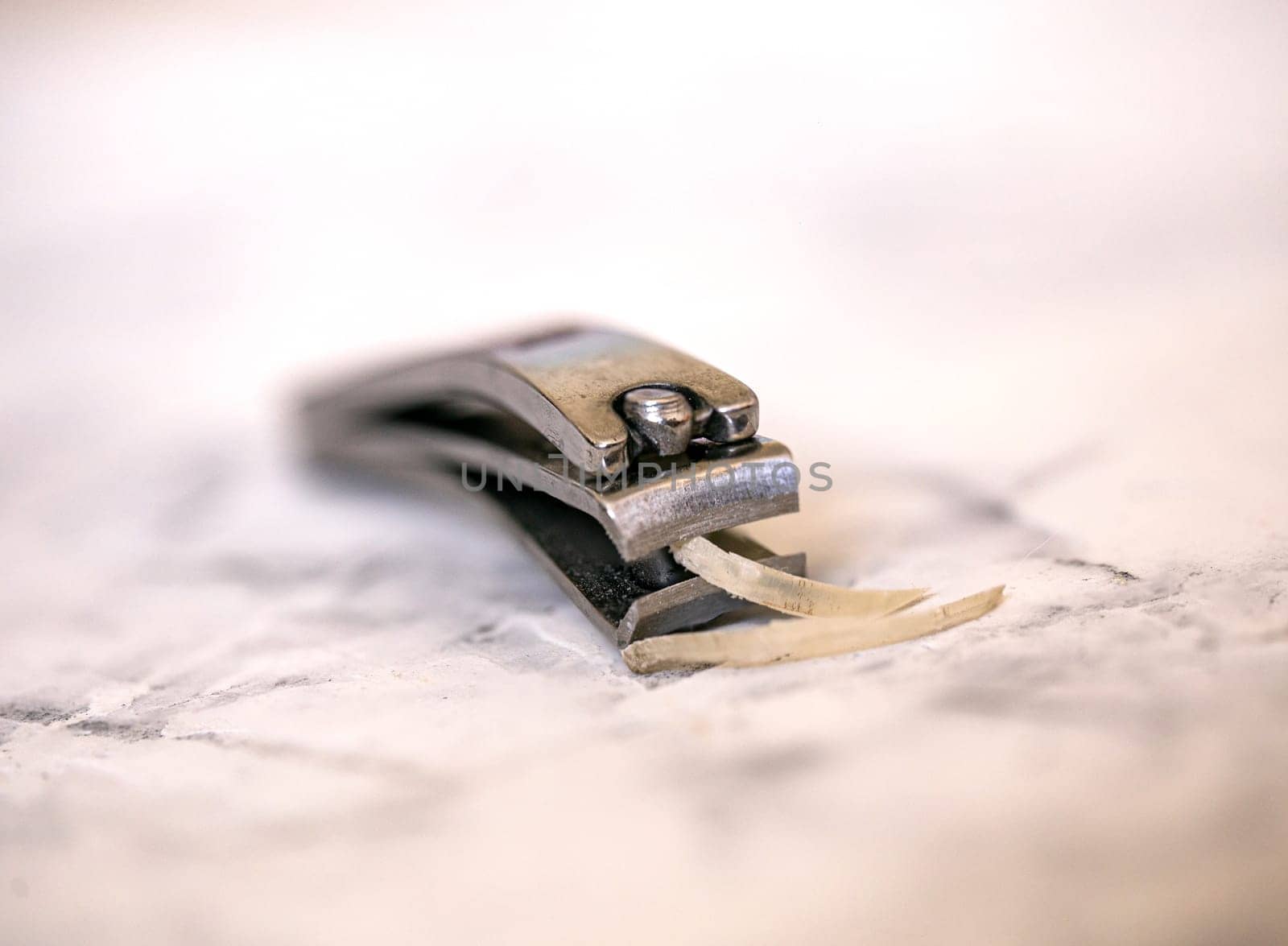 clipped human nails with metal cutters