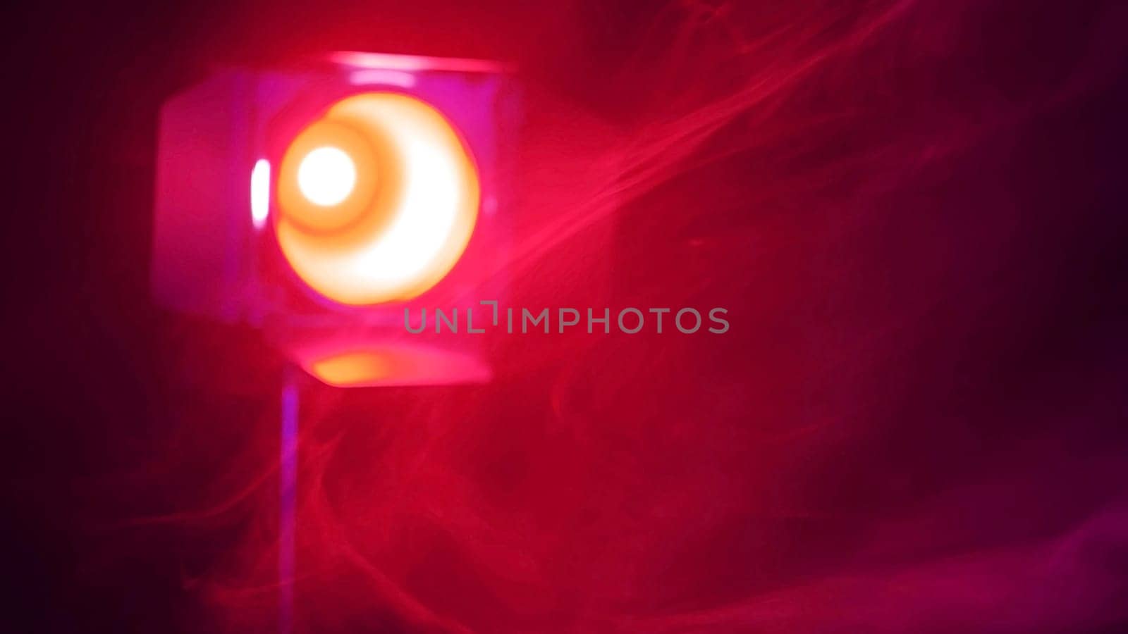 Professional microphone in red smoke on a black background. by mrwed54