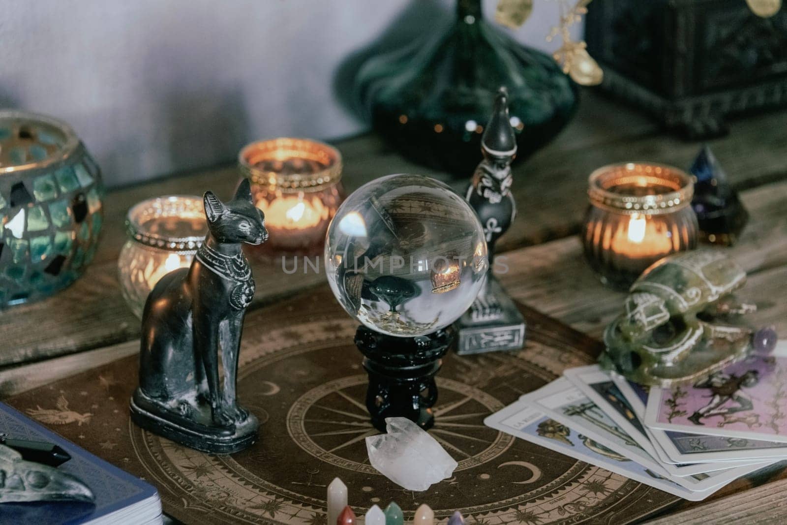 Esoteric Tarot and Crystal Ball Setup with Mystical Decor