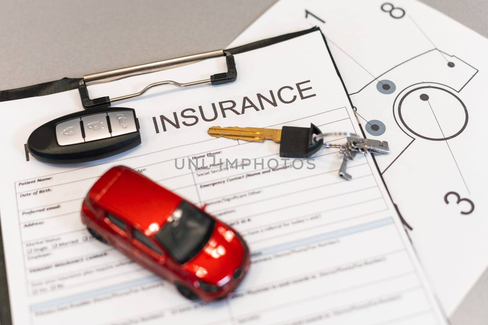 Car insurance form with model and policy document . High quality photo