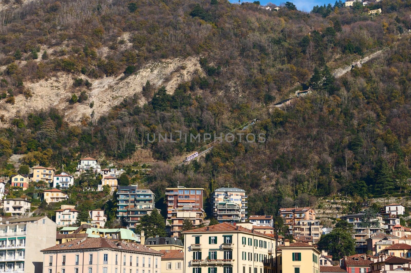 Como Lago. Italian city of Como in Alps mountains. Beautiful houses in mountain. Travel. Buildings. Tourism concept. Italy, Lombardy, the province of Milan.