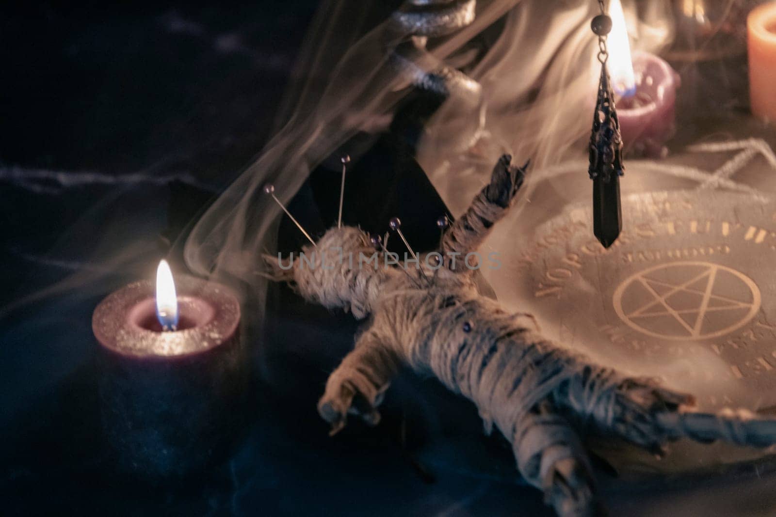 Mysterious Occult Ceremony with Pendulum and Mystic Symbols