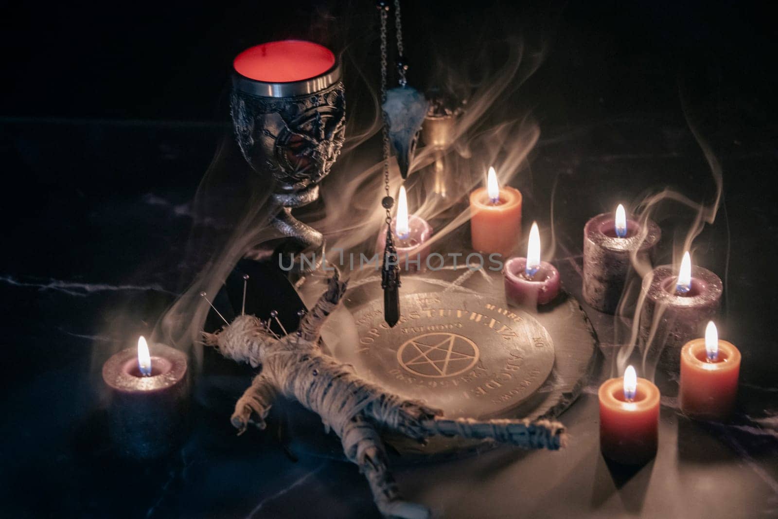 Mysterious Occult Ceremony with Pendulum and Mystic Symbols