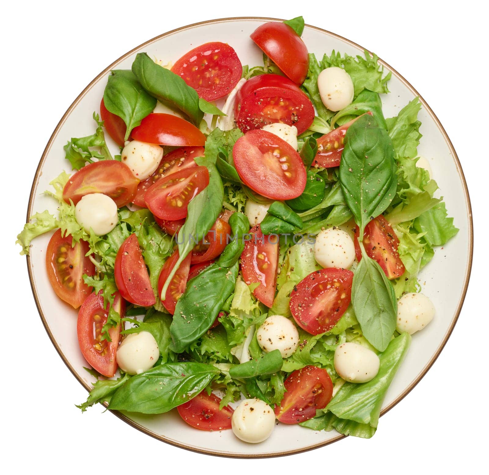 Salad with mozzarella, cherry tomatoes and green lettuce in a white round plate  by ndanko