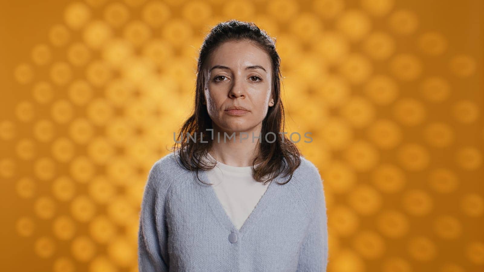 Person dressed in casual attire standing, isolated over studio background by DCStudio