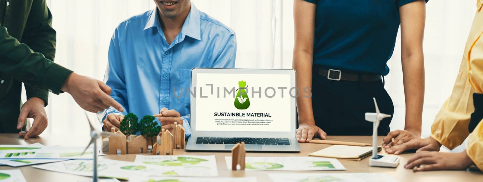 Sustainable material illustration displayed on laptop during green business meeting. ESG environment social governance and Eco conservative concept. Front view. Closeup. Delineation.