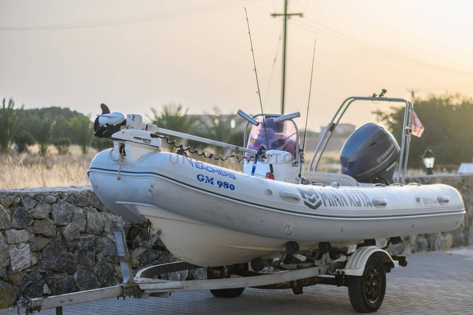Gaziveren Cyprus - 04.24.2024 white fishing rubber boat on trailer 5