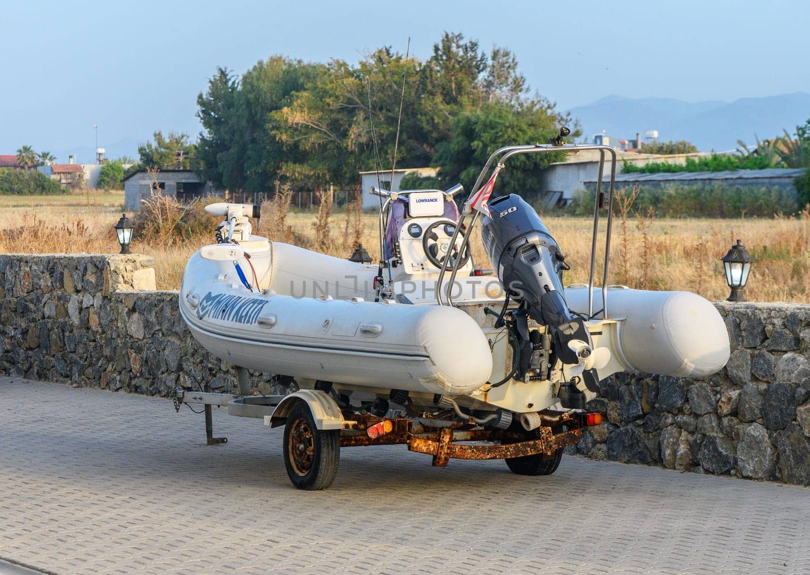 Gaziveren Cyprus - 04.24.2024 white fishing rubber boat on trailer 3
