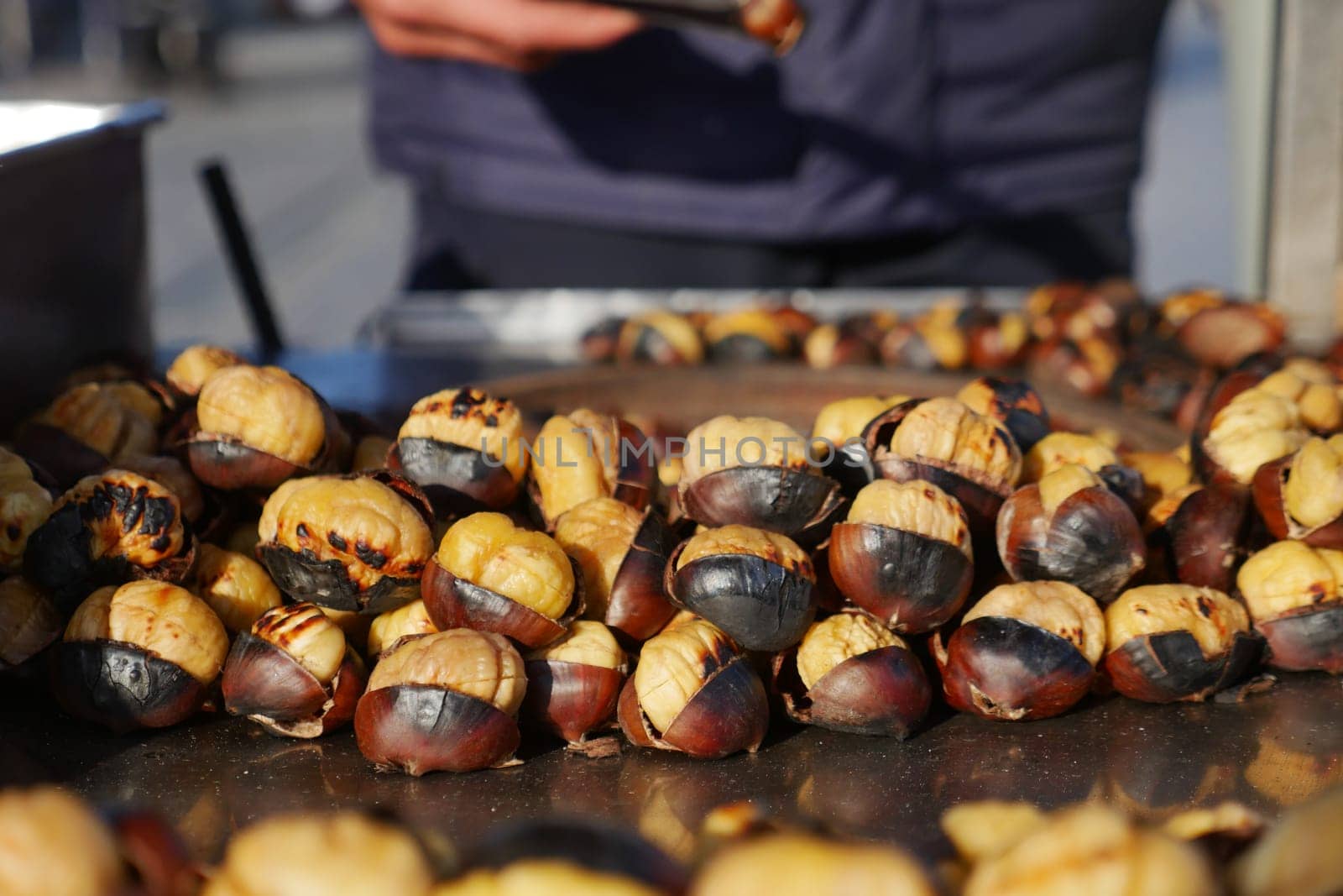traditional Istanbul street food grilled chestnuts in a row.