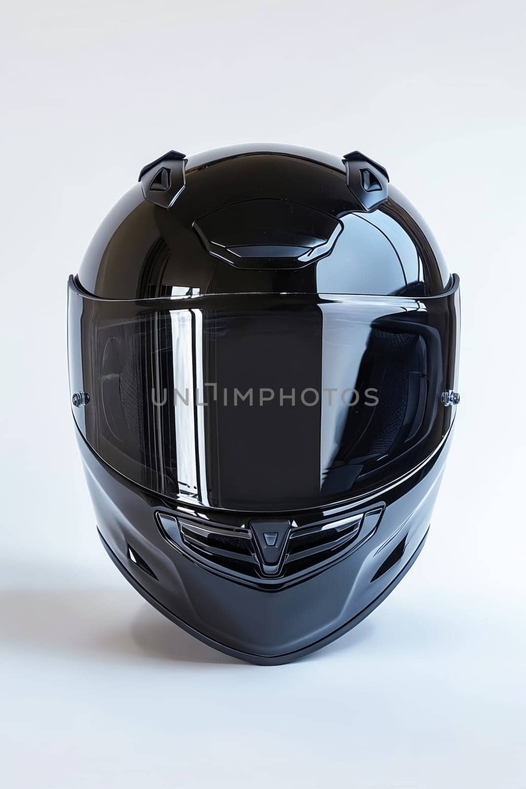 A black motorcycle helmet is sitting on a white background. The helmet is shiny and reflective, giving it a sleek and modern appearance. Generative AI