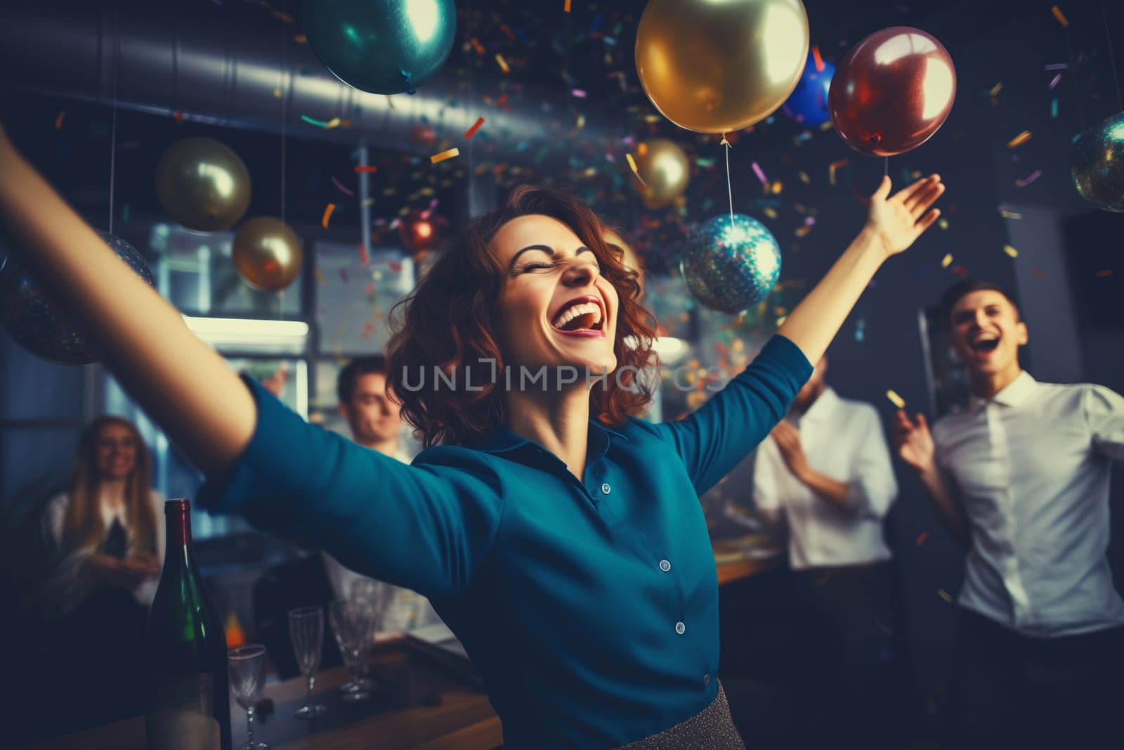 Joyful businesswoman celebrating with her colleagues business people having a party having fun in the office