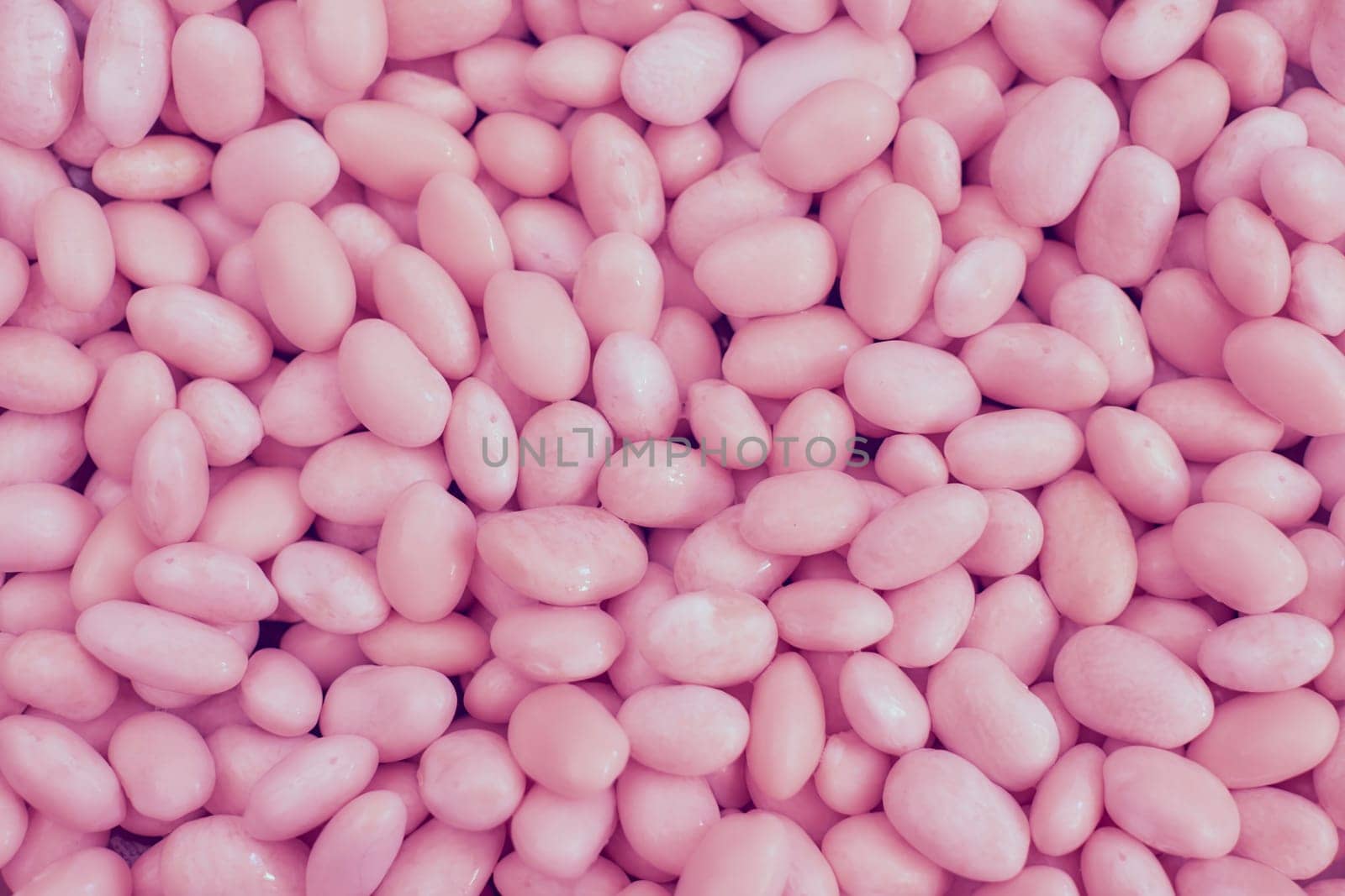 Pink abstract beans, sweet candies, pebbles, backdrop by jovani68