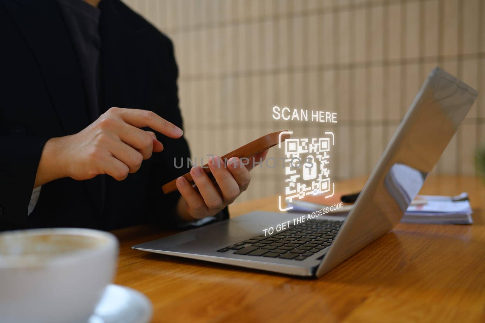 Businessman scanning QR code with smart phone for payment and ID verification. Cybersecurity concept by prathanchorruangsak
