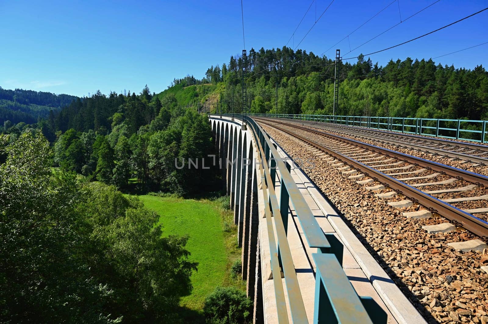 Big railway bridge in the valley. Dolni Loucky - Czech Republic. Concept for transport and travel by train. by Montypeter