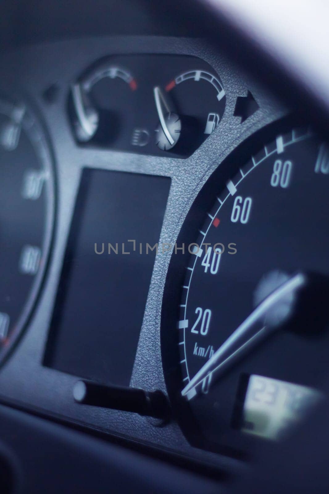 A closeup of a cars speedometer displaying a speed 0 close up