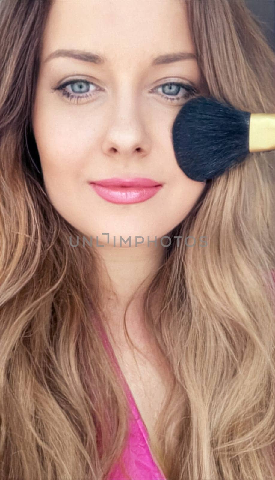 Beautiful young woman applying cosmetic powder product with makeup brush, beauty, makeup and skincare cosmetics model face portrait, closeup