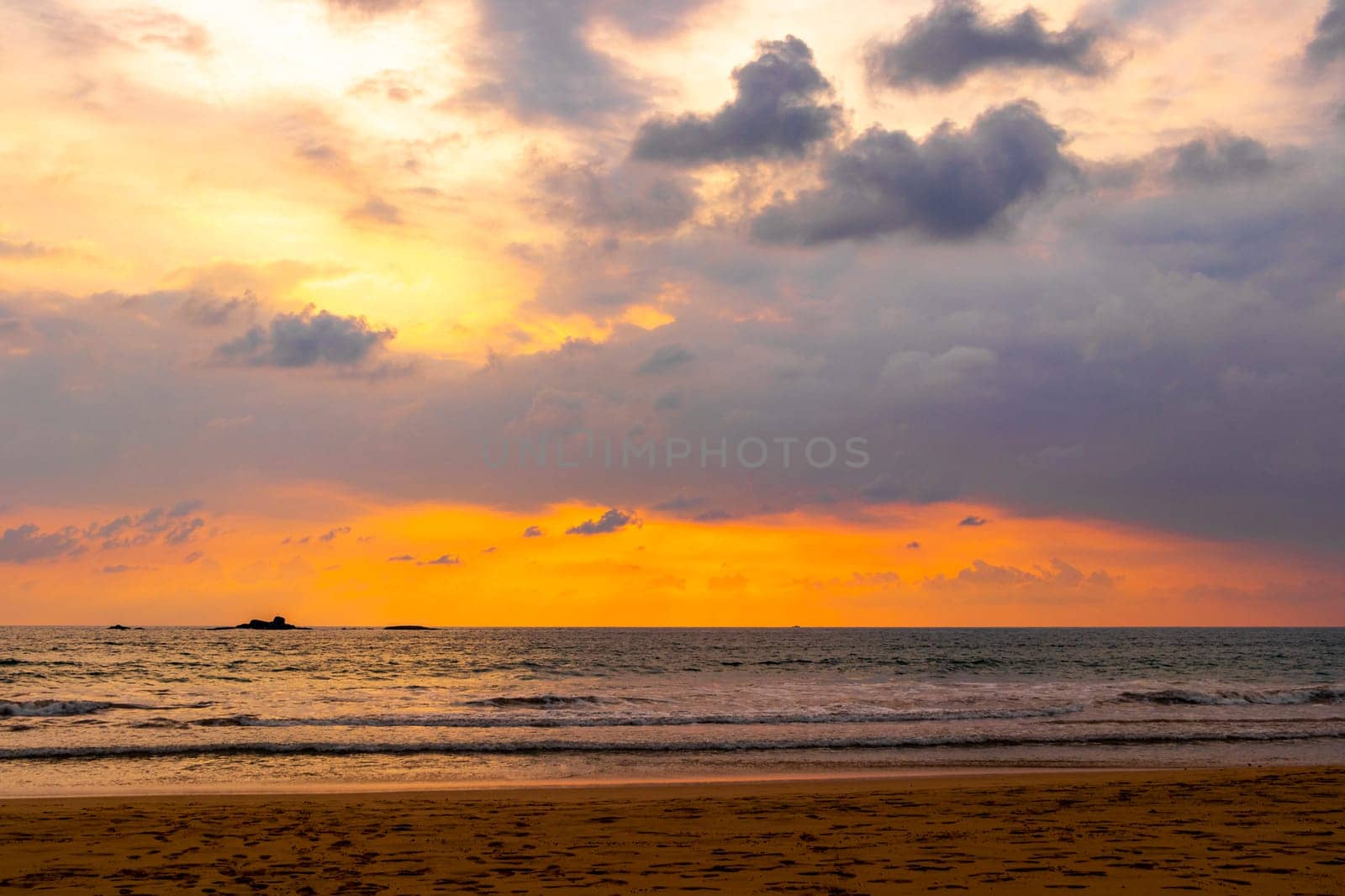 Beautiful colorful sunset and landscape panorama from Bentota Beach on Sri Lanka island.