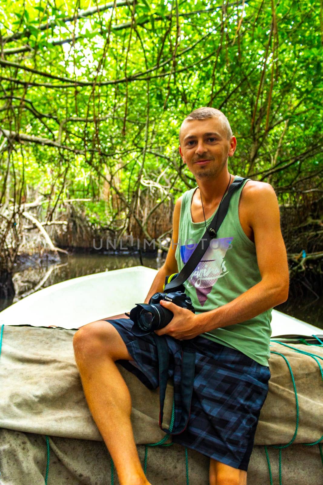 Boat safari mangrove jungle man male tourist River Bentota Beach Sri Lanka. by Arkadij