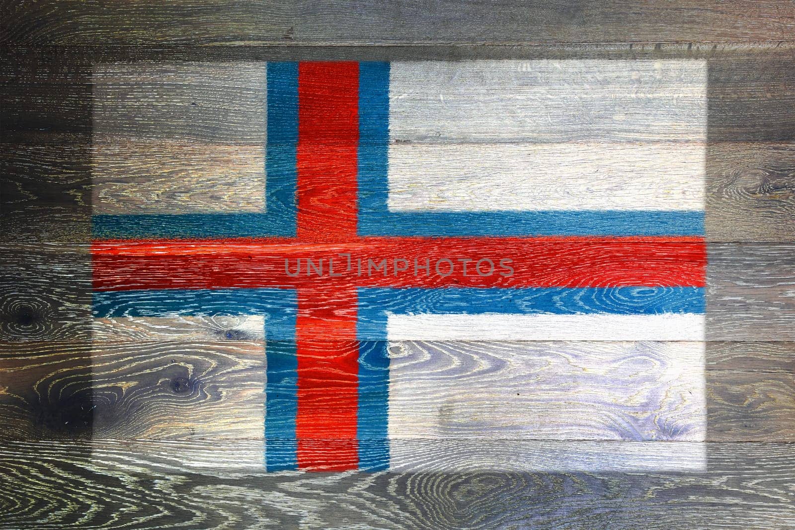 Faroe islands flag on rustic old wood by VivacityImages