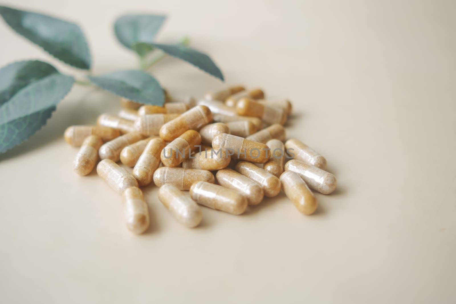 herbal medicine capsules on light color background .