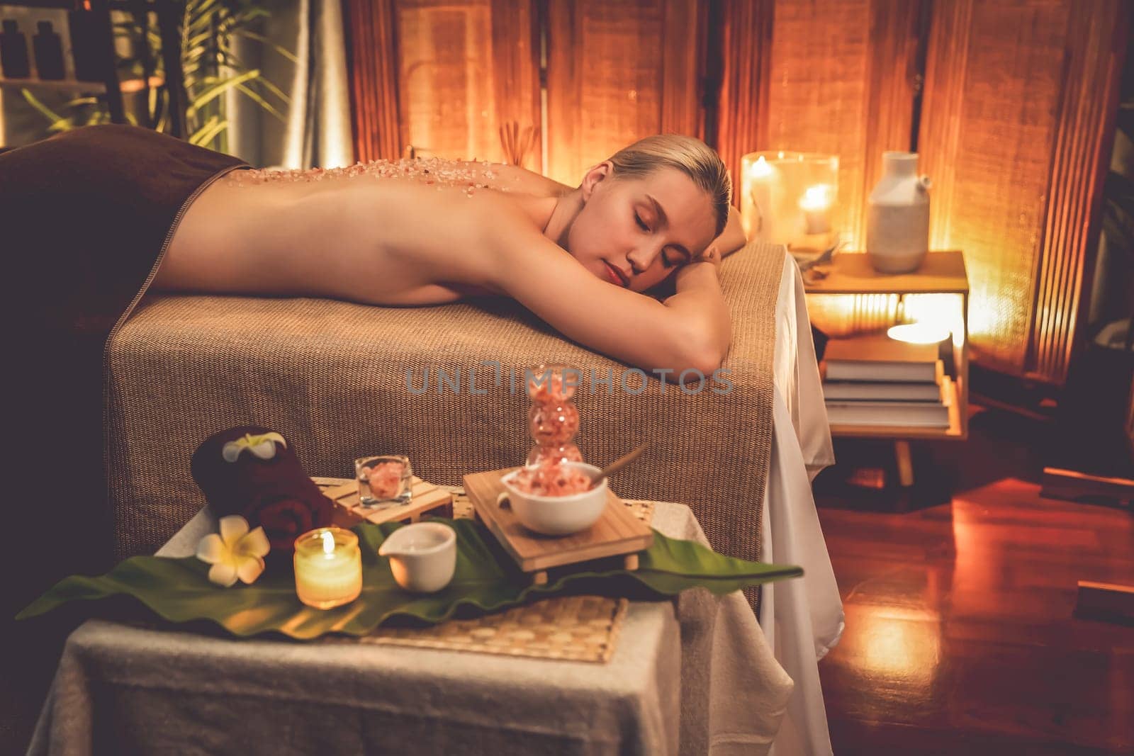 Woman customer having exfoliation treatment in luxury spa. Quiescent by biancoblue
