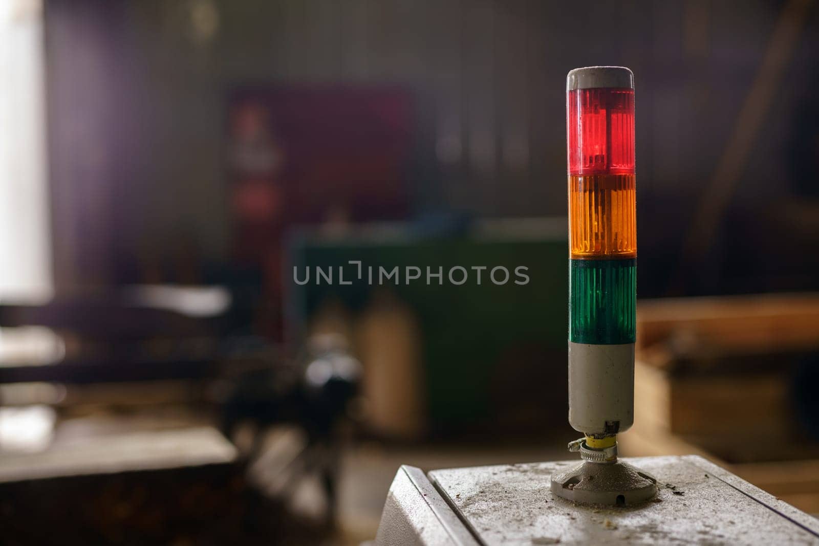 Close-up of tri-color LED on machine at sawmill by rivertime