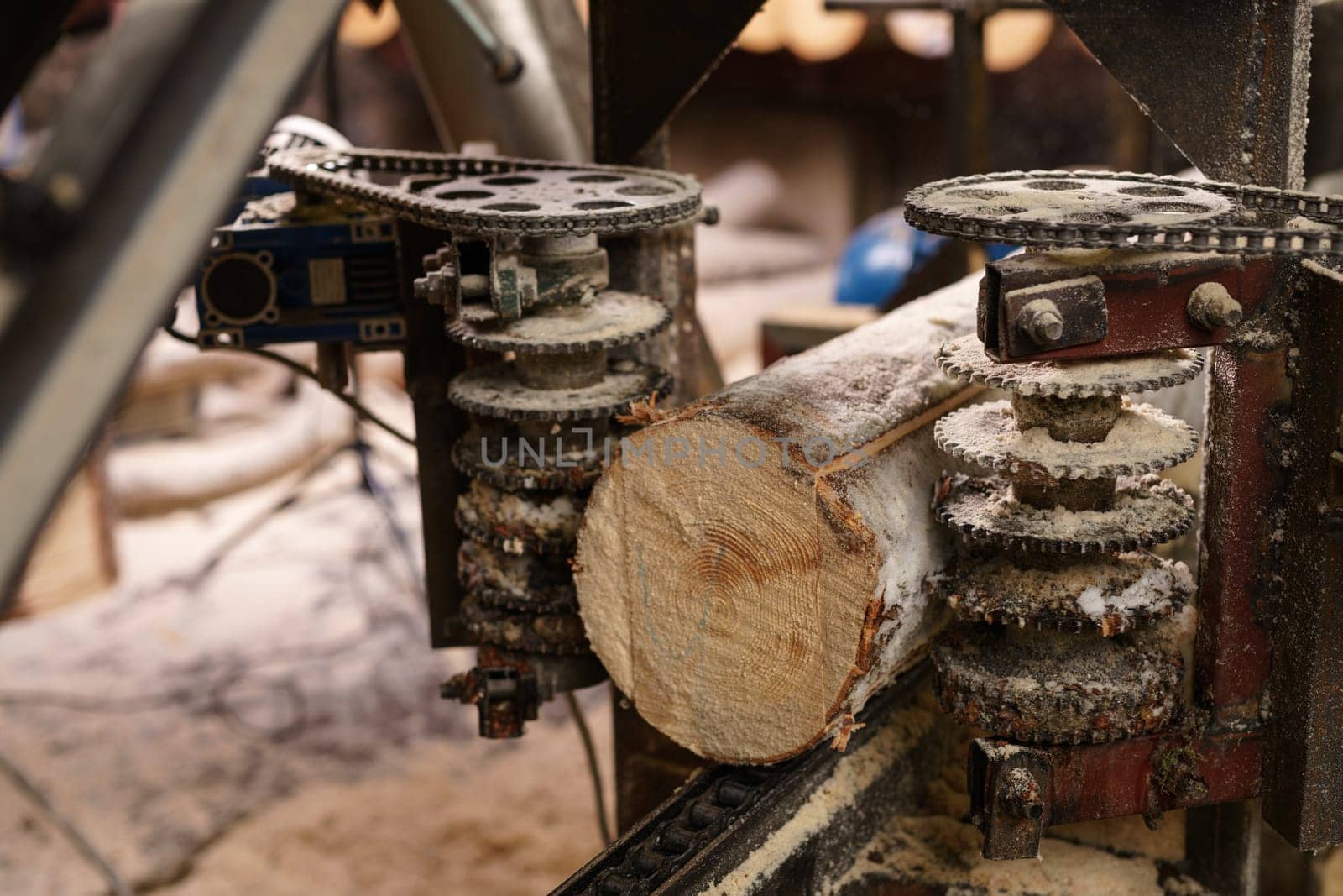 Image of machine for sawing wood at sawmill by rivertime