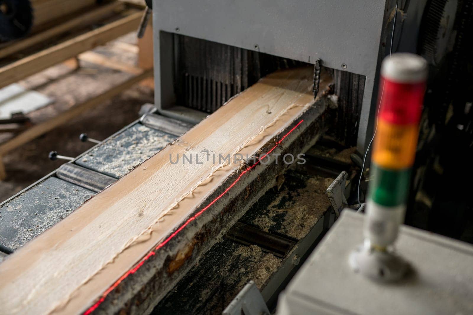 At sawmill. Image of sawing wood with laser marks, close-up