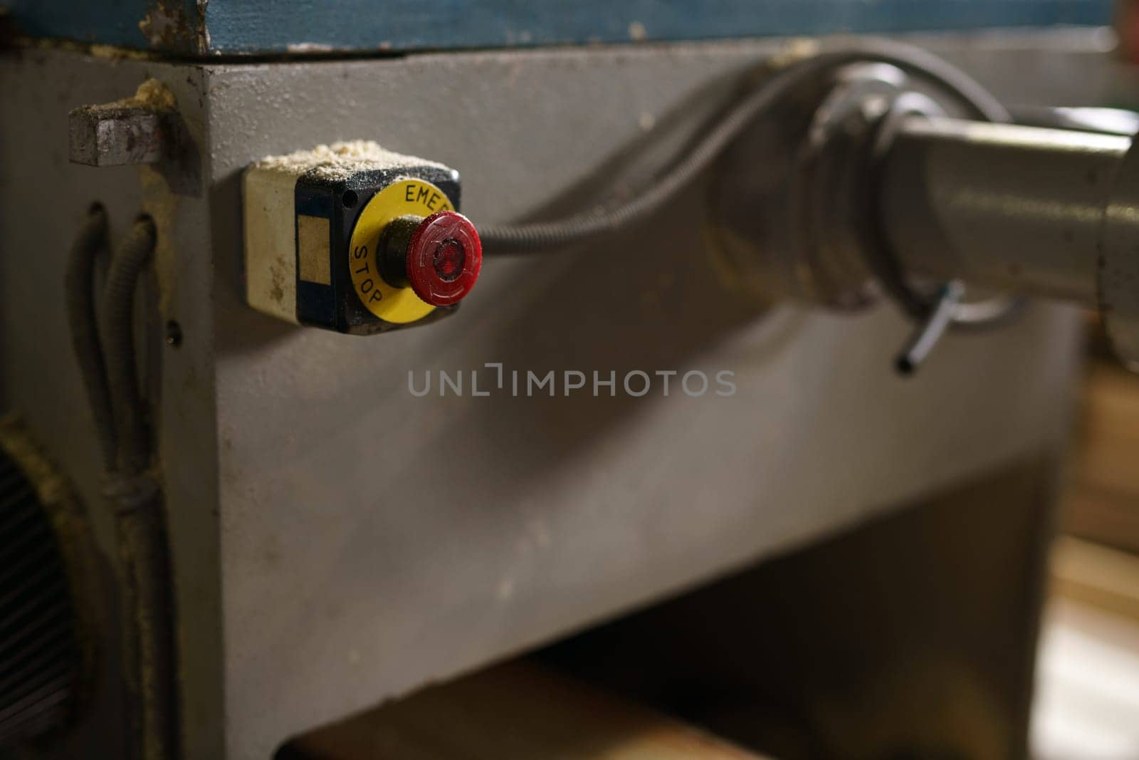 At sawmill. Stop button on machine, close-up by rivertime