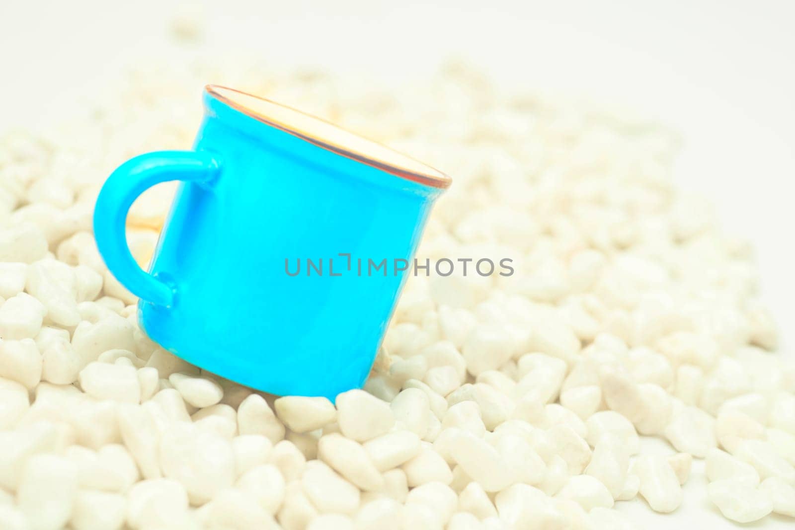 Time of ceremony for tea and coffee,beverages.Blue cup on white stones by jovani68