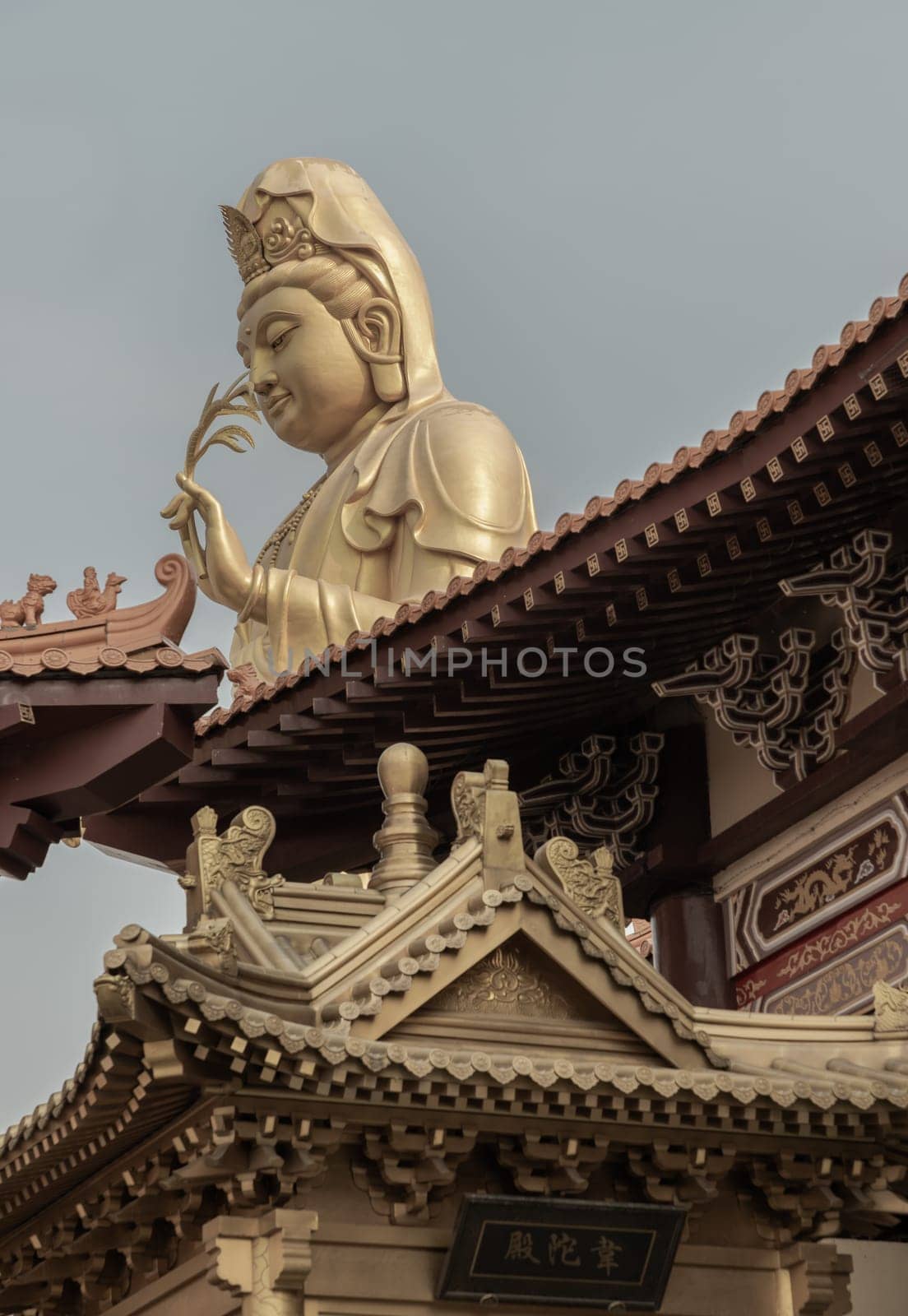 Big Golden statue goddess of Mercy Guanyin or Quan Yin statue at Fo Guang Shan Thaihua Temple.  by tosirikul