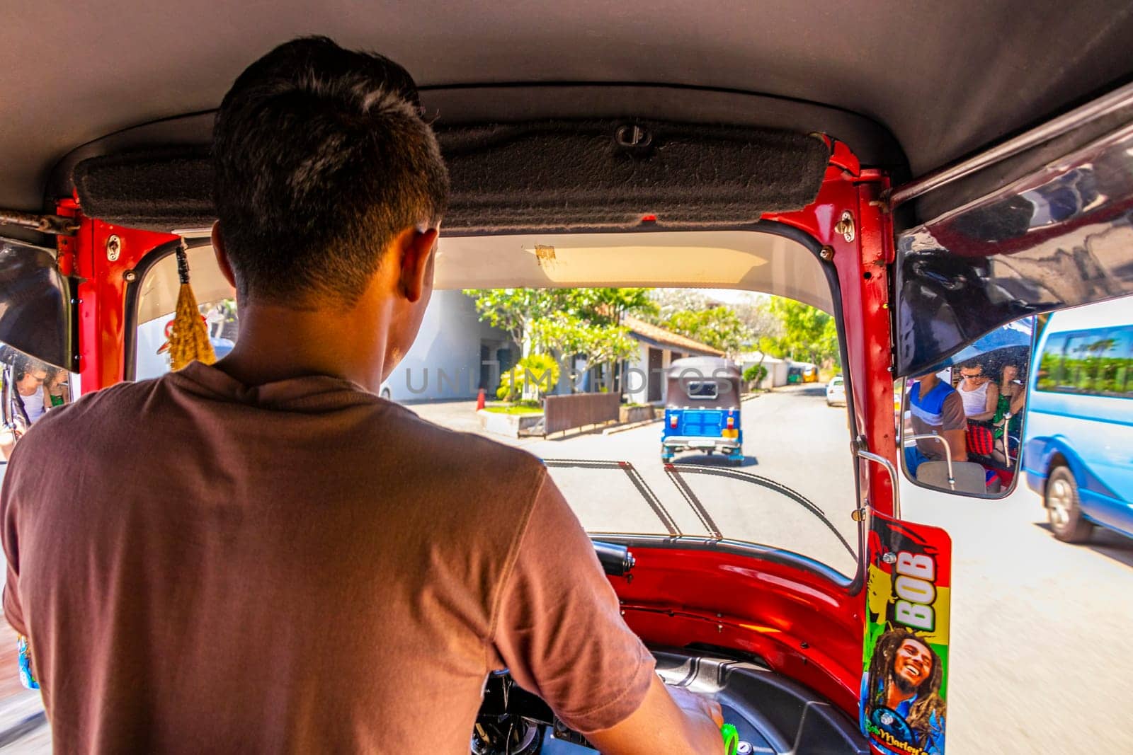 Bentota Beach Southern Province Sri Lanka 16. March 2018 Driving a red Rickshaw Tuk Tuk cab vehicle in Bentota Beach Galle District Southern Province Sri Lanka.