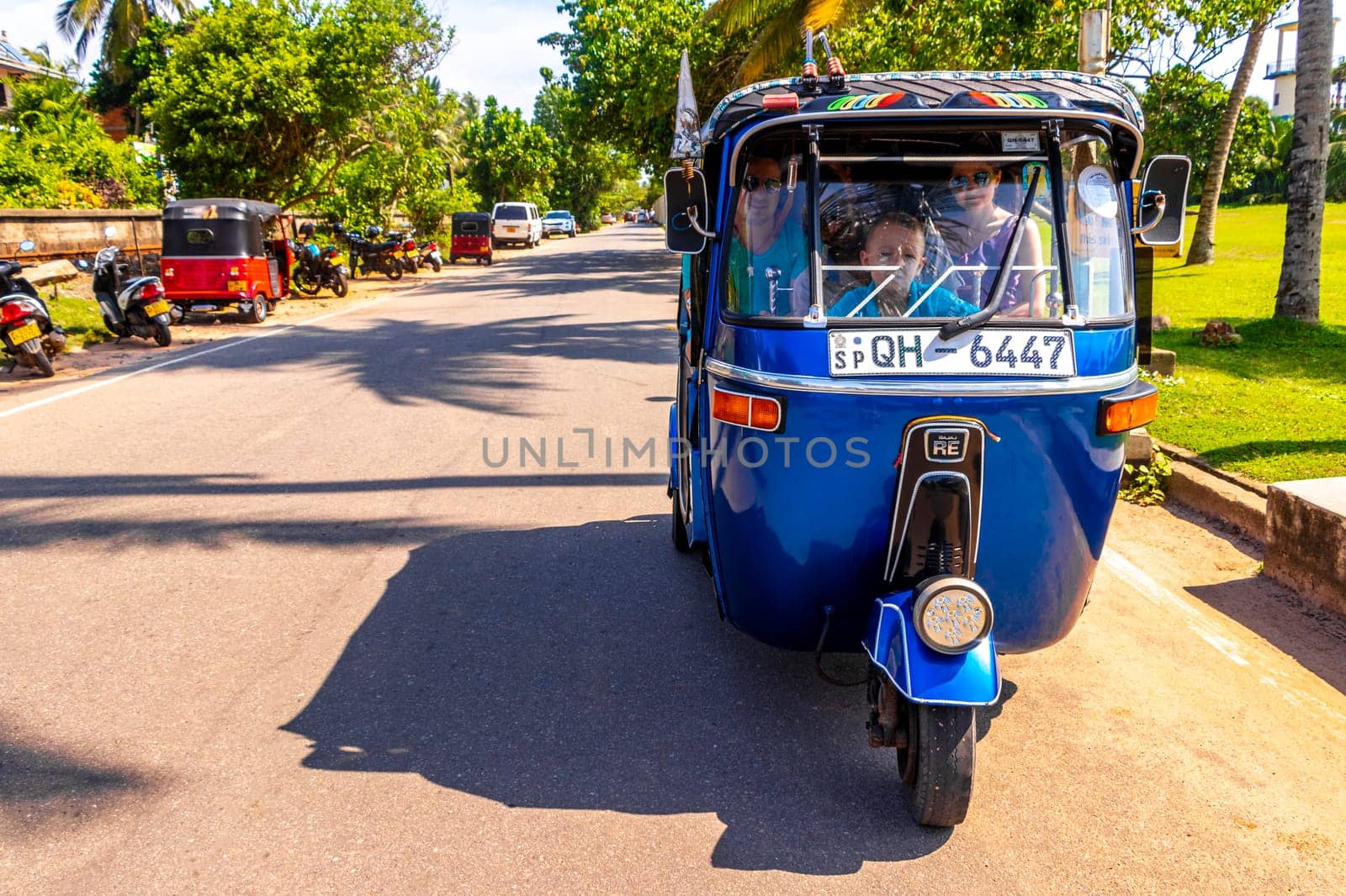 Blue Rickshaw Tuk Tuk cab vehicle Bentota Beach Sri Lanka. by Arkadij