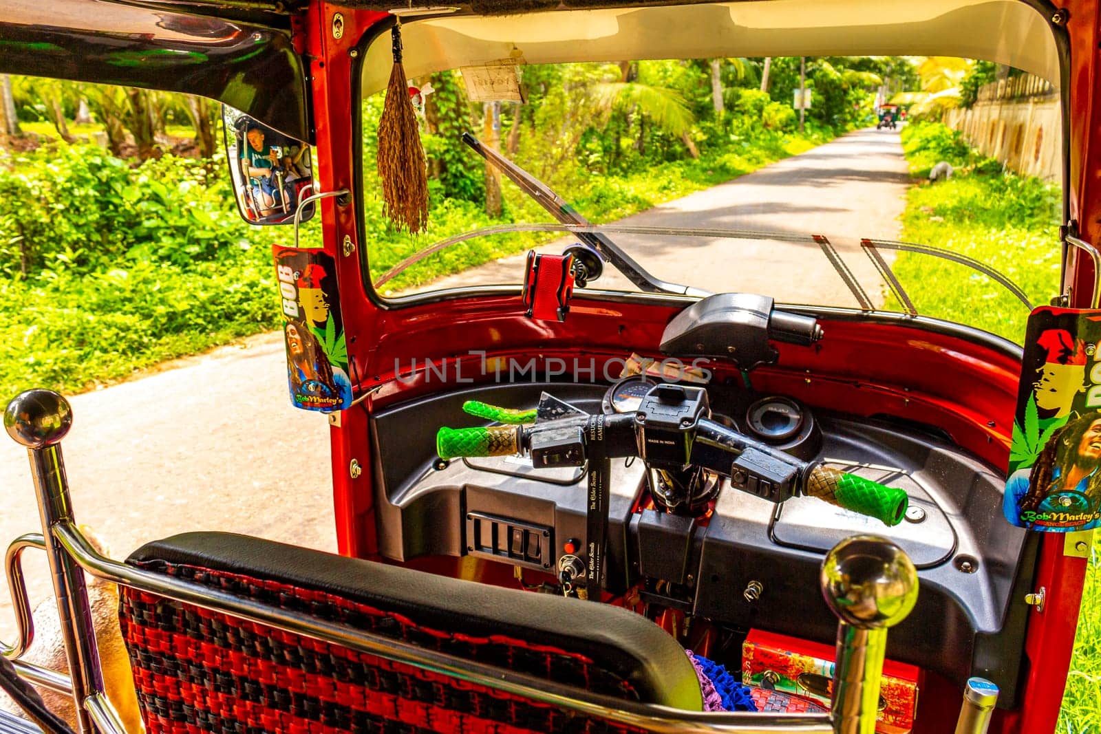 Bentota Beach Southern Province Sri Lanka 16. March 2018 Driving a red Rickshaw Tuk Tuk cab vehicle in Bentota Beach Galle District Southern Province Sri Lanka.