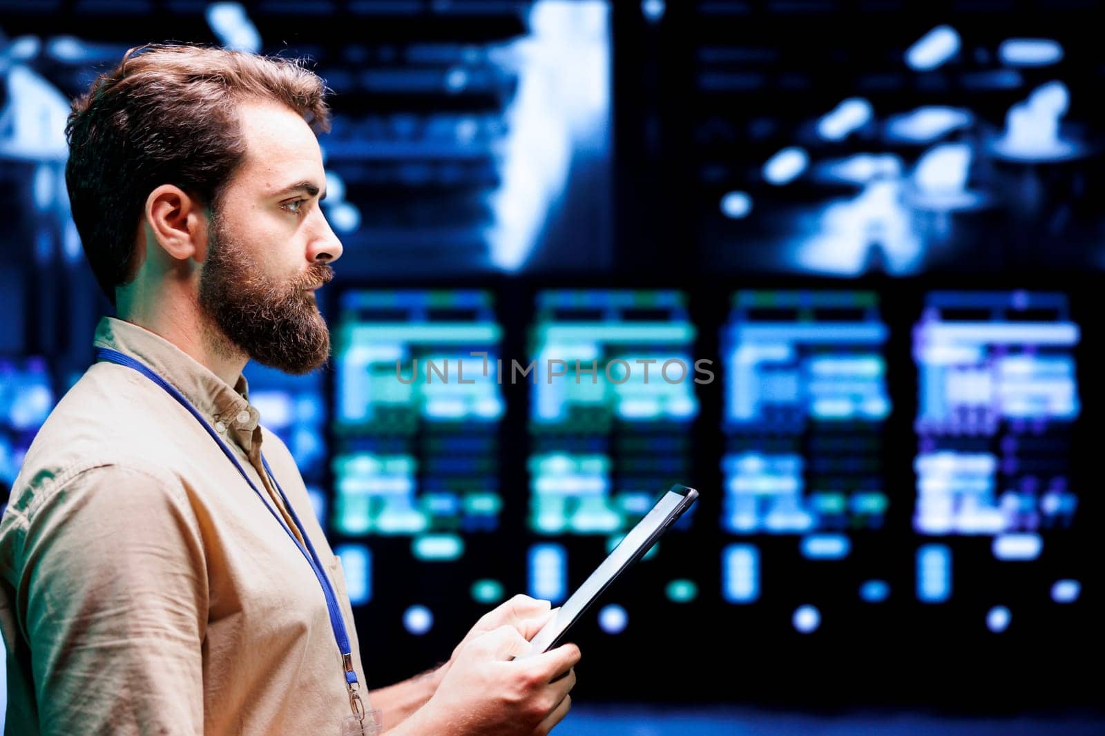 IT developer setting up high tech data center firewalls, intrusion detection systems and doing security updates. Cybersecurity employee preventing hacking, malware, and DDoS attacks in server hub