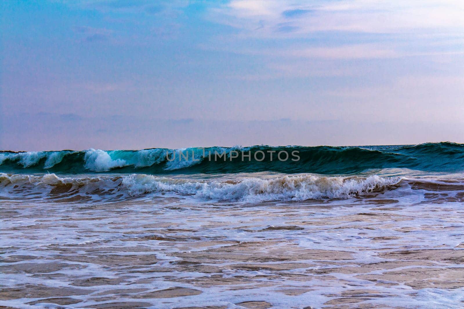 Beautiful sunny landscape panorama with huge powerful waves and clear water in Bentota Beach Galle District Southern Province Sri Lanka island.