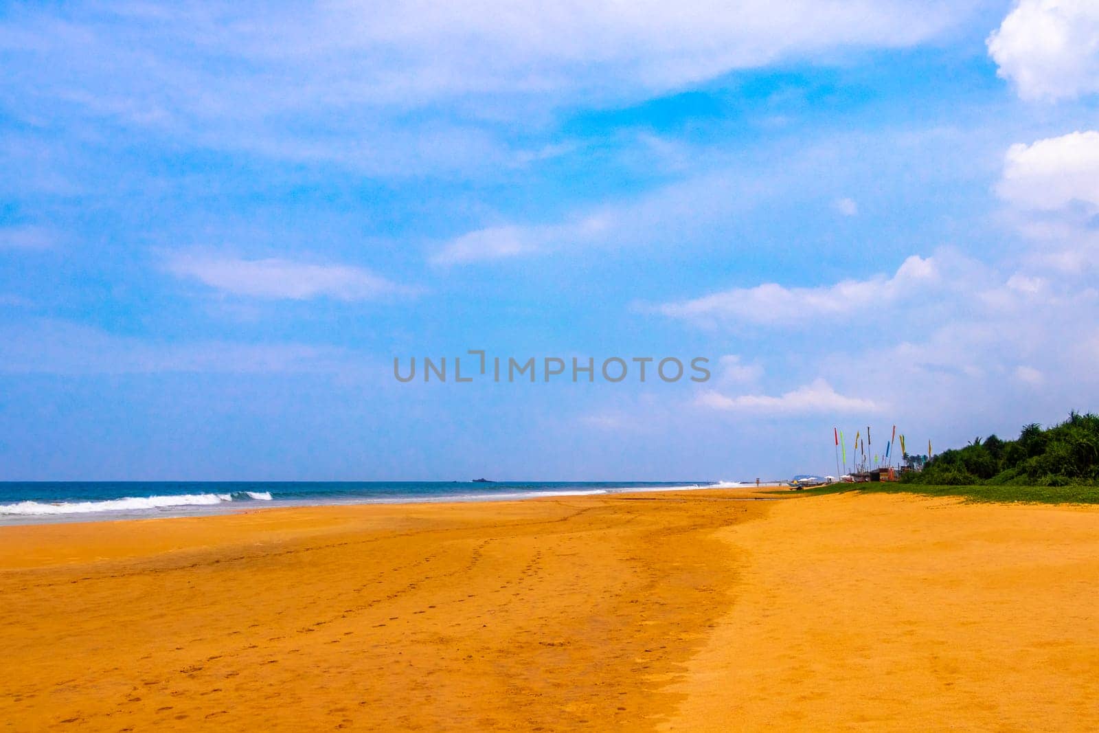 Beautiful sunny landscape panorama with huge powerful waves and clear water in Bentota Beach Galle District Southern Province Sri Lanka island.