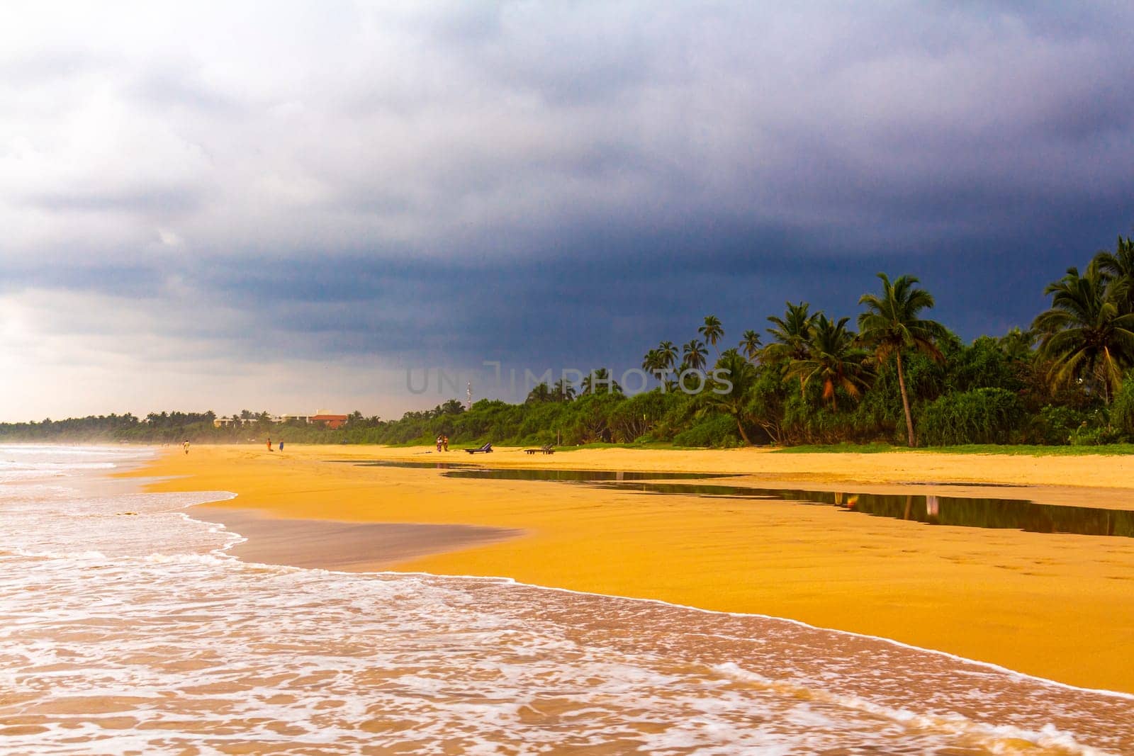 Beautiful sunny landscape panorama with huge powerful waves and clear water in Bentota Beach Galle District Southern Province Sri Lanka island.