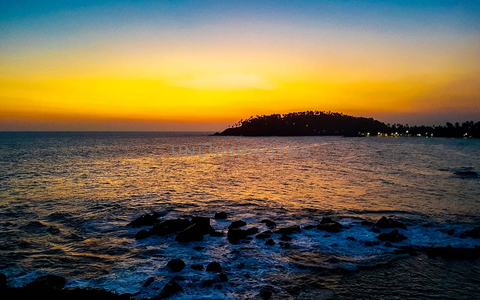 Beautiful colorful sunset on the beach in Mirissa Beach Matara District Southern Province Sri Lanka.