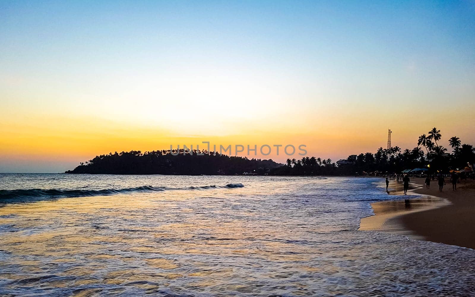 Beautiful colorful sunset on the beach in Mirissa Beach Matara District Southern Province Sri Lanka.