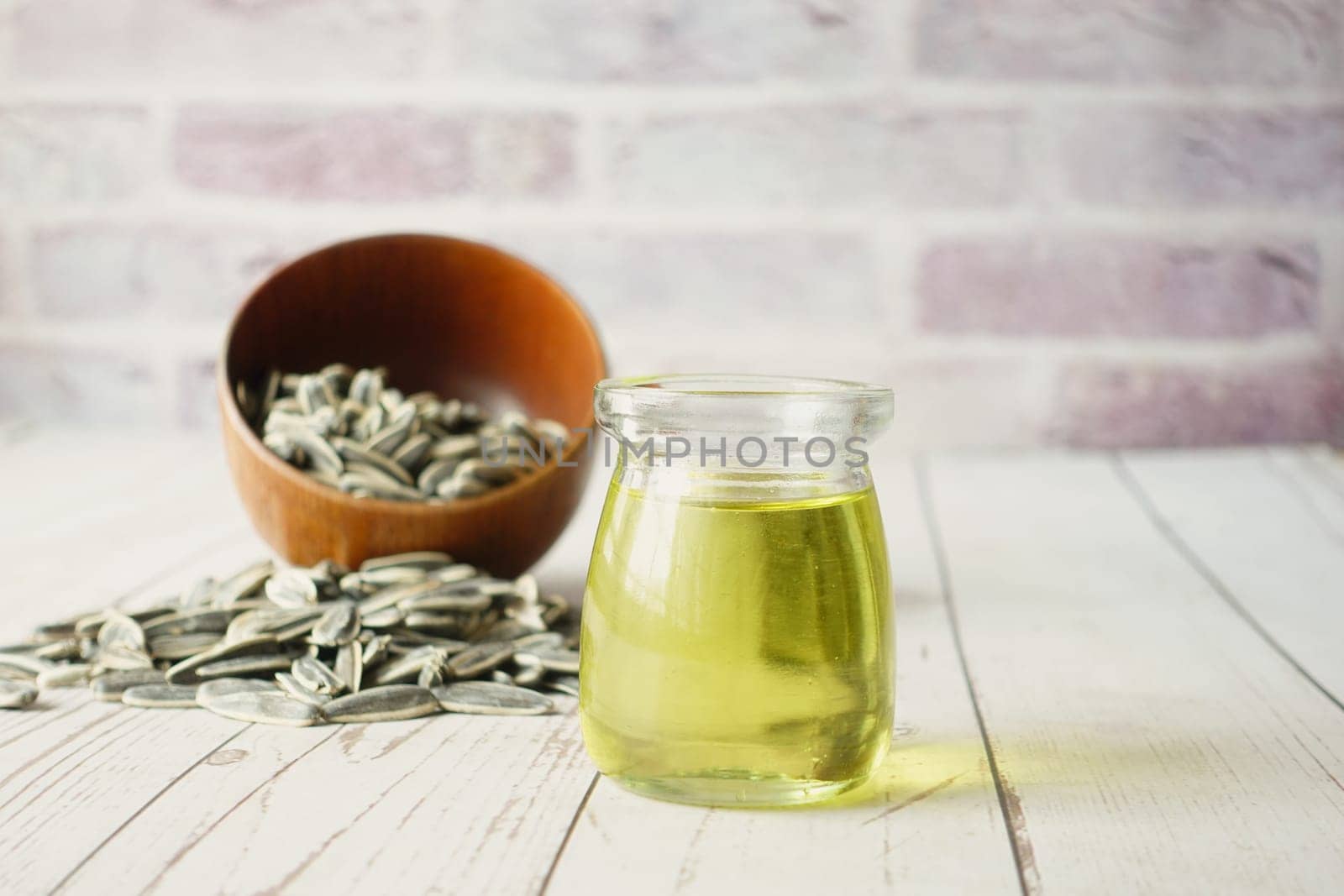 sunflower oil seed and oil in a container on table ,
