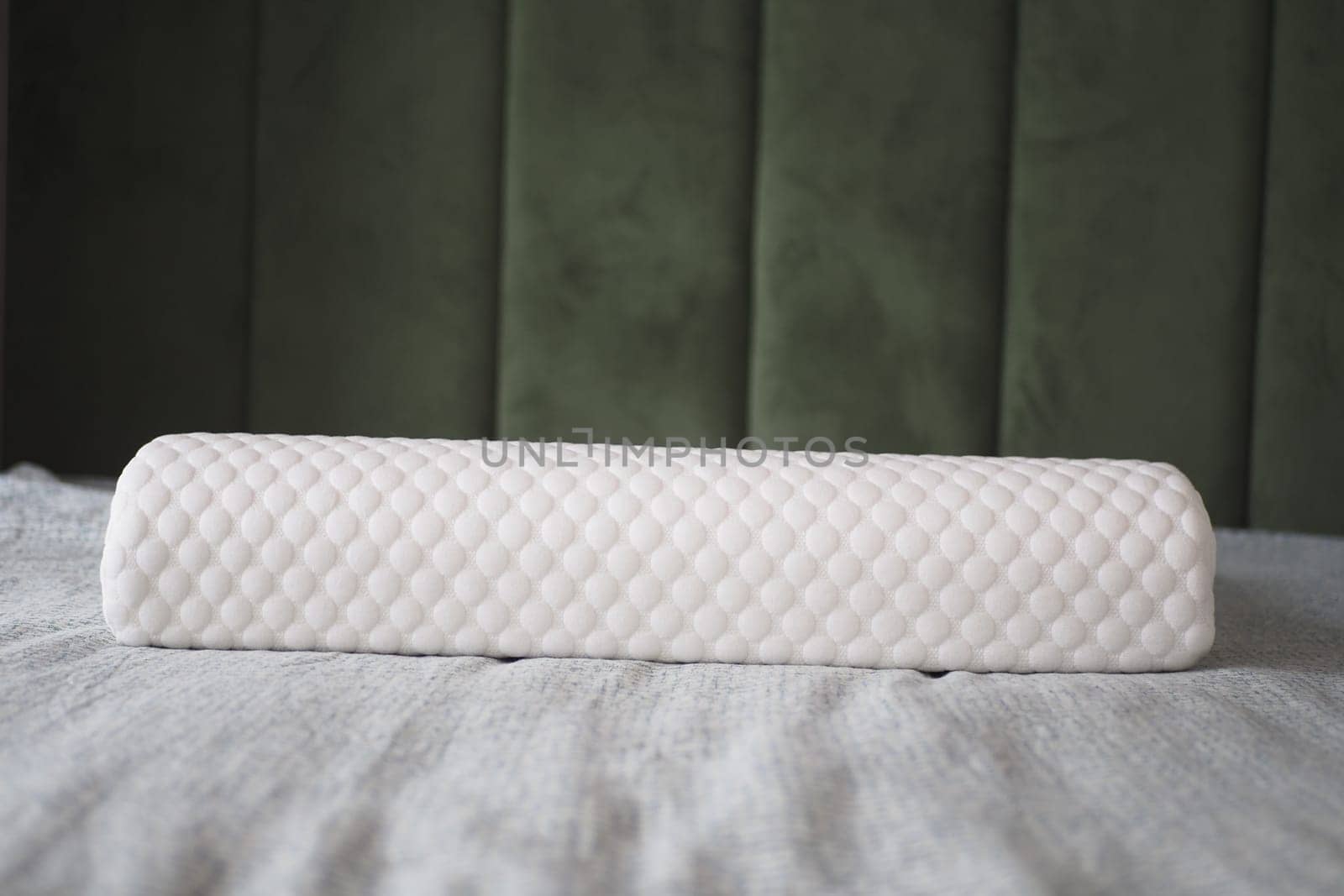 Orthopedic pillow on a bed ,