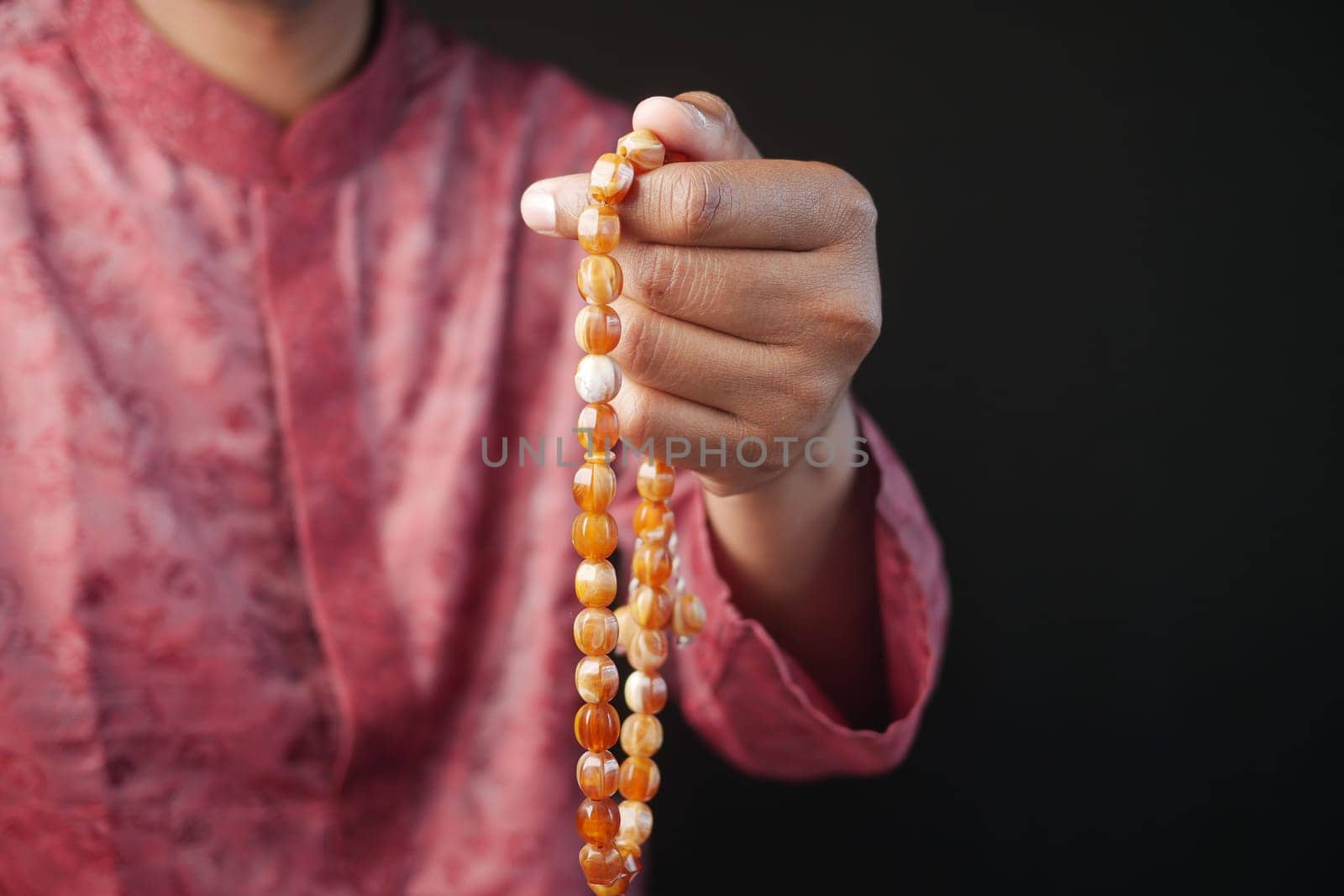 muslim man praying during ramadan .
