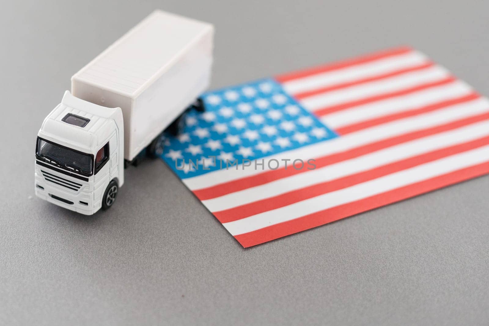 USA Logistics Concept. White Delivery Van on USA Flag background. 3d Rendering. High quality photo