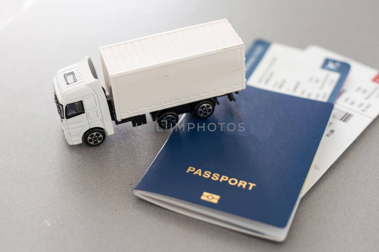 Big White toy truck over Tickets on a white background. 3d Rendering. High quality photo