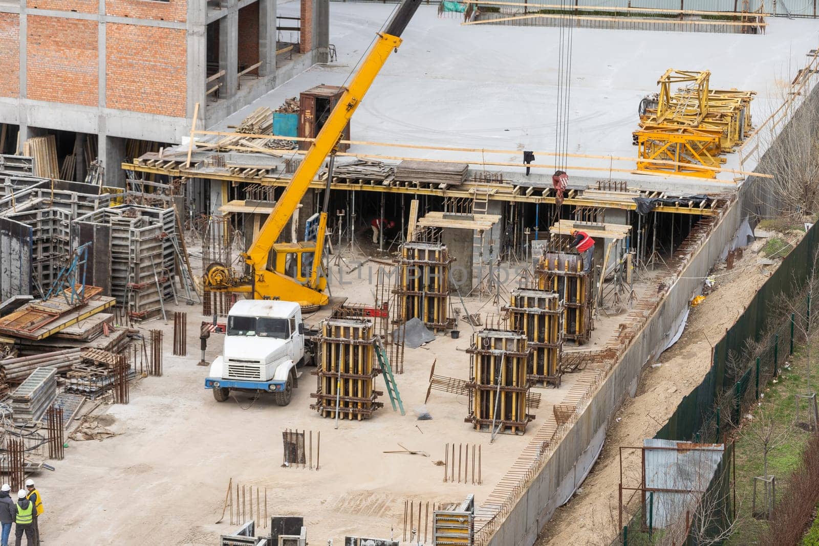 Aerial view of construction site, construction of new building in residential area. High quality photo