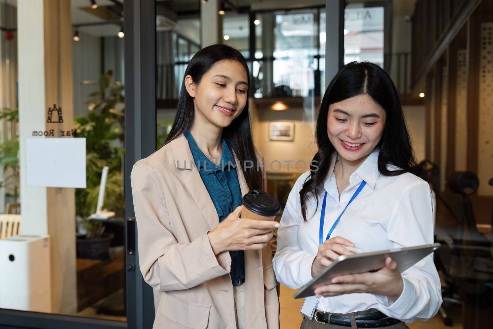 Business woman talking and brainstorming, discussion with colleague about strategy.