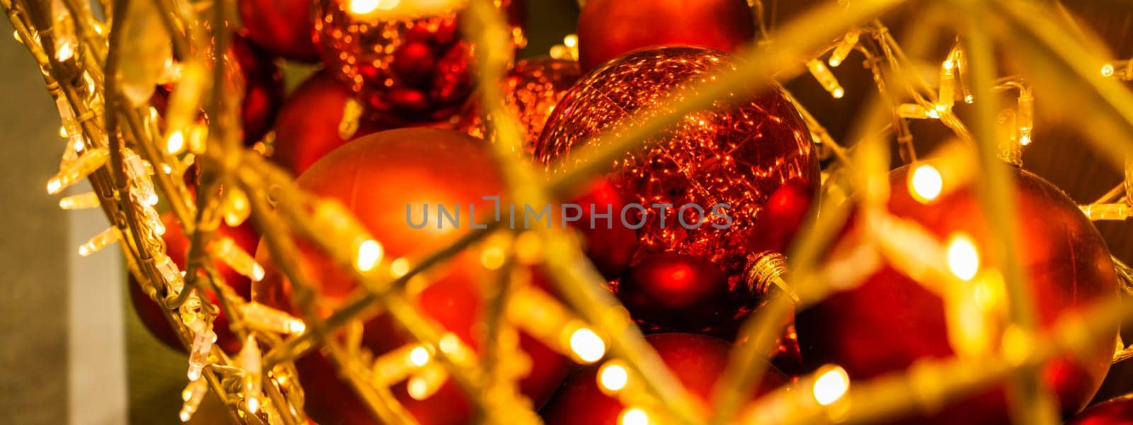 Banner close up of red Christmas balls baubles. Bokeh garlands. Xmas and holidays concept. Copy space and empty place for text, mock up greeting card by Satura86