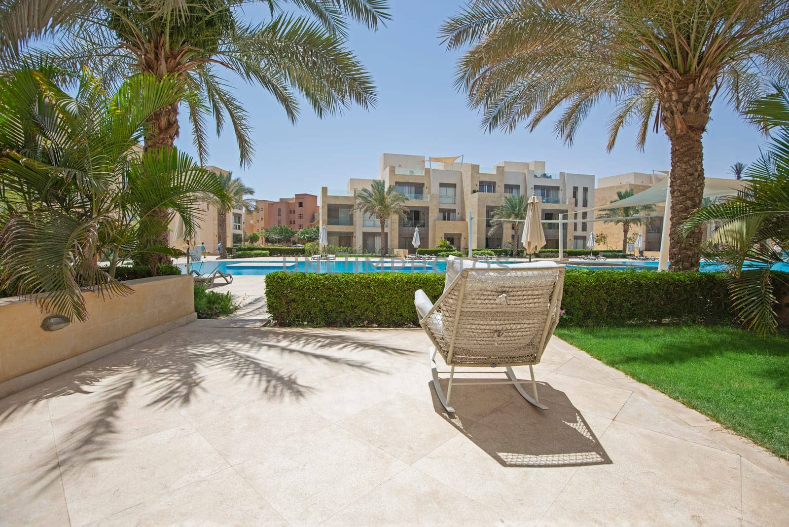 Patio terrace garden with chair in tropical luxury apartment resort by paulvinten