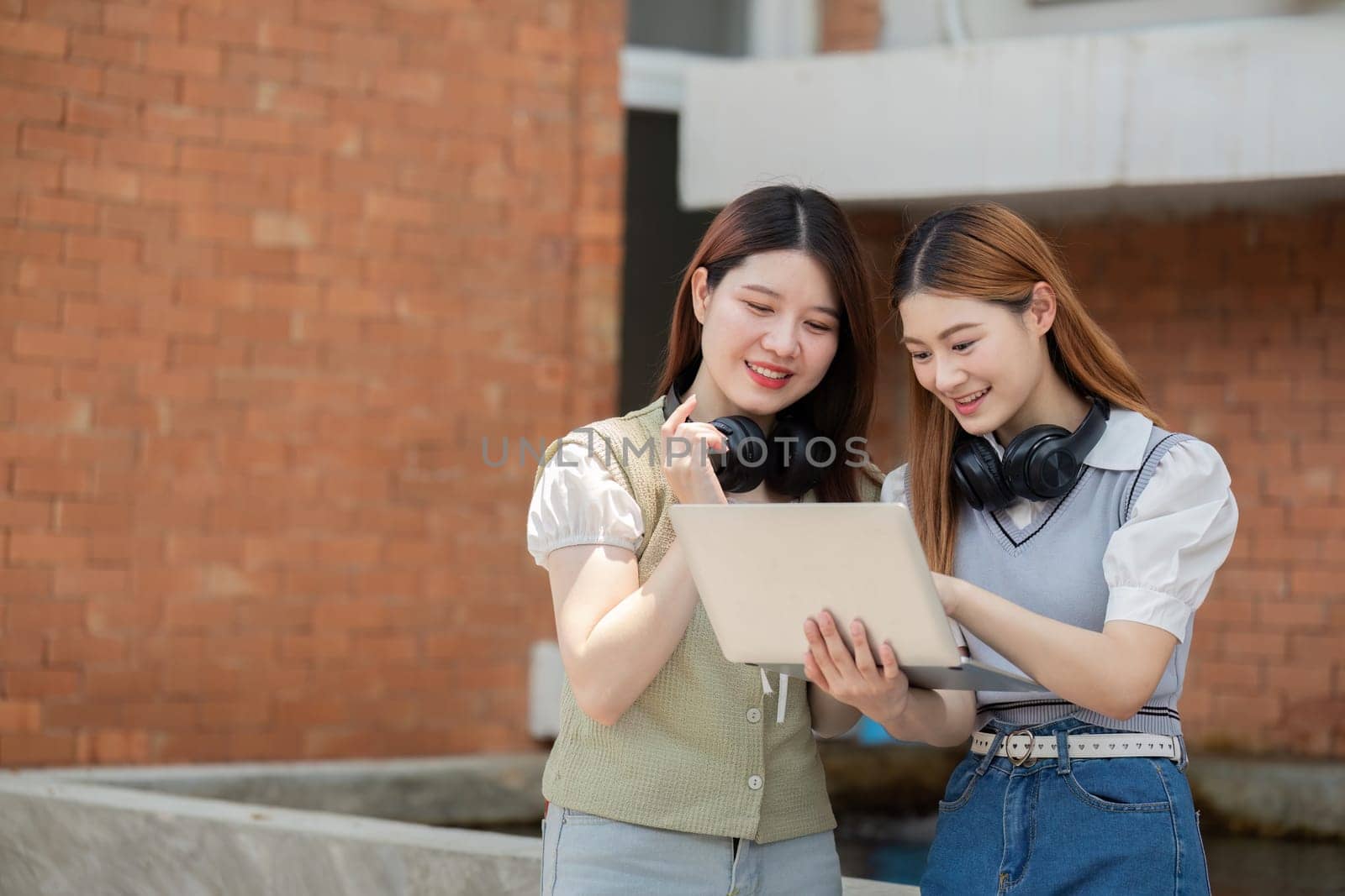 Asian young campus student enjoy learn study and reading books together. Friendship and Education concept. Campus and university.
